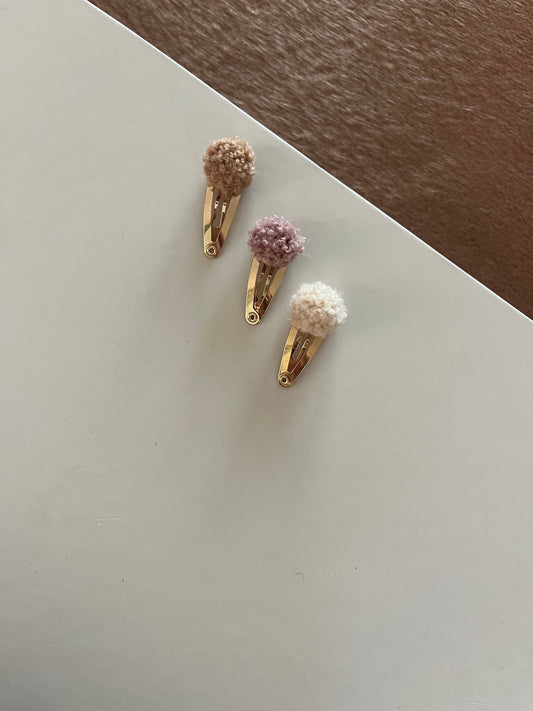 Pompons set goud beige